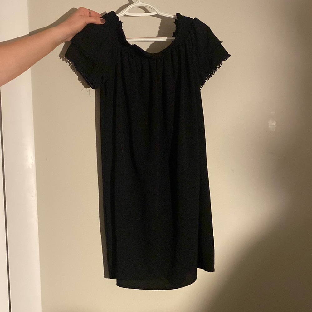 Black mini dress. Off the shoulder.